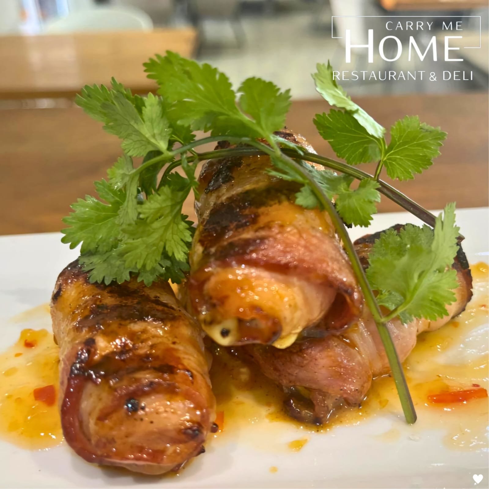 Bacon-wrapped chicken fillets with sweet chilli sauce and coriander